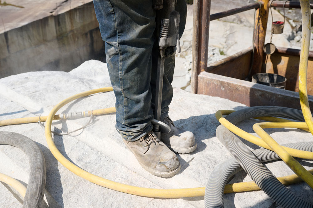 A man wearing Chippewa Steel Toe Boots on a job site.